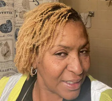 Angela W., a Cota customer, in the photo she shared with her review